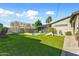 Manicured backyard features lush green grass, sparkling pool, and inviting pergola at 4627 E Montecito Ave, Phoenix, AZ 85018