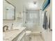 Bright bathroom with a walk-in shower, modern vanity, and stylish mirror at 4627 E Montecito Ave, Phoenix, AZ 85018