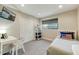 Cozy bedroom featuring a clean workspace, closet and a window at 4627 E Montecito Ave, Phoenix, AZ 85018