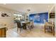 Inviting dining room boasting a rustic table and a chic blue accent wall at 4627 E Montecito Ave, Phoenix, AZ 85018