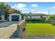Charming home showcasing a well-manicured lawn and a nicely designed retaining wall at 4627 E Montecito Ave, Phoenix, AZ 85018