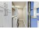 Well-equipped laundry room featuring modern washer, dryer, and ample cabinet space at 4627 E Montecito Ave, Phoenix, AZ 85018