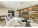 Bright living room with a wood accent wall, comfortable seating, and an open view of the modern kitchen at 4627 E Montecito Ave, Phoenix, AZ 85018