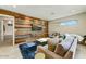 Bright living room features a unique wood accent wall and sleek modern furnishings at 4627 E Montecito Ave, Phoenix, AZ 85018