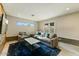 Modern living room with recessed lighting, a plush sofa, accent chairs, and stylish decor at 4627 E Montecito Ave, Phoenix, AZ 85018