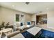Cozy living room with neutral tones, comfortable seating, a blue rug, and a bright, open atmosphere at 4627 E Montecito Ave, Phoenix, AZ 85018
