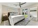 Sun-drenched main bedroom featuring a plush bed, soft rug, and access to the yard at 4627 E Montecito Ave, Phoenix, AZ 85018