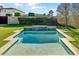 Inviting pool featuring clean design, lush greenery, and privacy landscaping at 4627 E Montecito Ave, Phoenix, AZ 85018