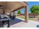 Spacious covered back patio ideal for outdoor seating, grilling, and entertaining guests at 5445 S 239Th Dr, Buckeye, AZ 85326