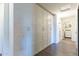 Hallway linen cabinets provide ample storage space with a laundry room at the end of the hall at 5445 S 239Th Dr, Buckeye, AZ 85326