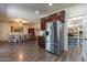 Spacious eat-in kitchen featuring stainless steel appliances and a walk-in pantry at 5445 S 239Th Dr, Buckeye, AZ 85326