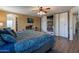 Comfortable main bedroom features an ensuite bathroom and custom wardrobe closet at 5445 S 239Th Dr, Buckeye, AZ 85326