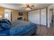 Comfortable main bedroom features an ensuite bathroom and custom wardrobe closet at 5445 S 239Th Dr, Buckeye, AZ 85326