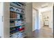 Walk-in pantry with adjustable shelving, providing ample storage space for organization at 5445 S 239Th Dr, Buckeye, AZ 85326