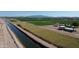 Expansive land with mountain views and irrigation canal offers great potential for agriculture and development at 6274 S Dean Rd, Buckeye, AZ 85326