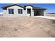 Charming single-story home featuring an attached two-car garage and well-lit entryway at 6274 S Dean Rd, Buckeye, AZ 85326