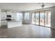 Bright living room featuring sliding doors with views of desert landscape at 6274 S Dean Rd, Buckeye, AZ 85326