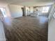 Spacious living room featuring tile flooring and a view into the bright kitchen at 6274 S Dean Rd, Buckeye, AZ 85326