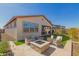Inviting backyard featuring a stone fire pit and outdoor seating area for entertaining guests at 7442 W Redbird Rd, Peoria, AZ 85383