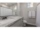 Bright bathroom features granite countertop, decorative towels, and shower with curtain at 7442 W Redbird Rd, Peoria, AZ 85383