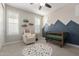 Adorable Bedroom with charming decor, a modern crib, and plenty of natural light at 7442 W Redbird Rd, Peoria, AZ 85383