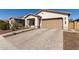 Inviting single-Gathering home featuring desert landscaping, neutral tones, and a two-car garage at 7442 W Redbird Rd, Peoria, AZ 85383