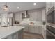 Well-equipped kitchen featuring stainless steel appliances, ample counter space, and modern cabinetry at 7442 W Redbird Rd, Peoria, AZ 85383