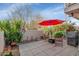 Back yard with tile flooring, seating, a grill, and potted plants at 7800 E Lincoln Dr # 1104, Scottsdale, AZ 85250