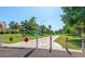 Neighborhood entrance with a walking path and abundant landscaping at 7800 E Lincoln Dr # 1104, Scottsdale, AZ 85250