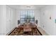 Cozy dining area with large window and stylish table and chairs at 7800 E Lincoln Dr # 1104, Scottsdale, AZ 85250
