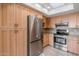 Kitchen showcasing a stainless steel refrigerator and ample cabinet space at 7800 E Lincoln Dr # 1104, Scottsdale, AZ 85250