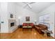 Bright living room with hardwood floors, fireplace, comfortable seating, and a vaulted ceiling at 7800 E Lincoln Dr # 1104, Scottsdale, AZ 85250