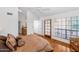 Spacious bedroom with hardwood floors, ceiling fan and access to an outdoor balcony at 7800 E Lincoln Dr # 1104, Scottsdale, AZ 85250