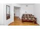 Sitting room with a futon couch, hard wood floors and natural light at 7800 E Lincoln Dr # 1104, Scottsdale, AZ 85250