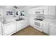 Modern kitchen featuring white cabinetry, countertops, appliances and a ceiling fan at 837 E Minton St, Phoenix, AZ 85042