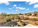 Expansive desert backyard with native vegetation, offering a natural and tranquil environment at 8540 E Mcdowell Rd # 19, Mesa, AZ 85207