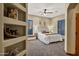 Inviting bedroom with a decorative dream catcher above the bed, soft carpet, and a ceiling fan at 8540 E Mcdowell Rd # 19, Mesa, AZ 85207