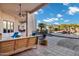 Desert home covered patio featuring an outdoor seating area and a view to pool and desert landscaping at 8540 E Mcdowell Rd # 19, Mesa, AZ 85207