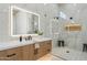 Modern bathroom featuring a glass shower, sleek fixtures, and stylish vanity at 9159 N 108Th Pl, Scottsdale, AZ 85259