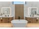 Contemporary bathroom featuring dual sink vanities and a standalone tub at 9159 N 108Th Pl, Scottsdale, AZ 85259