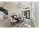 Modern dining room with a chandelier, outdoor access, and lots of natural light at 9159 N 108Th Pl, Scottsdale, AZ 85259
