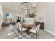 Dining room with vaulted ceilings, chandelier, and convenient access to other living areas at 9159 N 108Th Pl, Scottsdale, AZ 85259