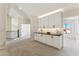 Second floor hallway with white cabinetry, black countertops, and modern lighting at 9159 N 108Th Pl, Scottsdale, AZ 85259