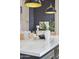 Kitchen island with marble countertop and woven chairs at 9159 N 108Th Pl, Scottsdale, AZ 85259
