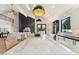 Open-concept kitchen featuring a large marble island and stainless steel appliances at 9159 N 108Th Pl, Scottsdale, AZ 85259