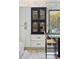 Modern kitchen with contrasting cabinetry, a beverage center, and a view of the backyard at 9159 N 108Th Pl, Scottsdale, AZ 85259