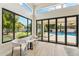Bright living room features large windows and door leading to the pool at 9159 N 108Th Pl, Scottsdale, AZ 85259