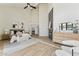 Spacious main bedroom with high ceilings, fireplace, sitting area, and neutral tones at 9159 N 108Th Pl, Scottsdale, AZ 85259