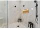 Modern walk-in shower with dual shower heads and built-in shelving at 9159 N 108Th Pl, Scottsdale, AZ 85259