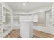 Walk-in closet with custom shelving and storage at 9159 N 108Th Pl, Scottsdale, AZ 85259